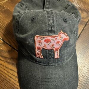 Women’s black hat with pink floral cow
